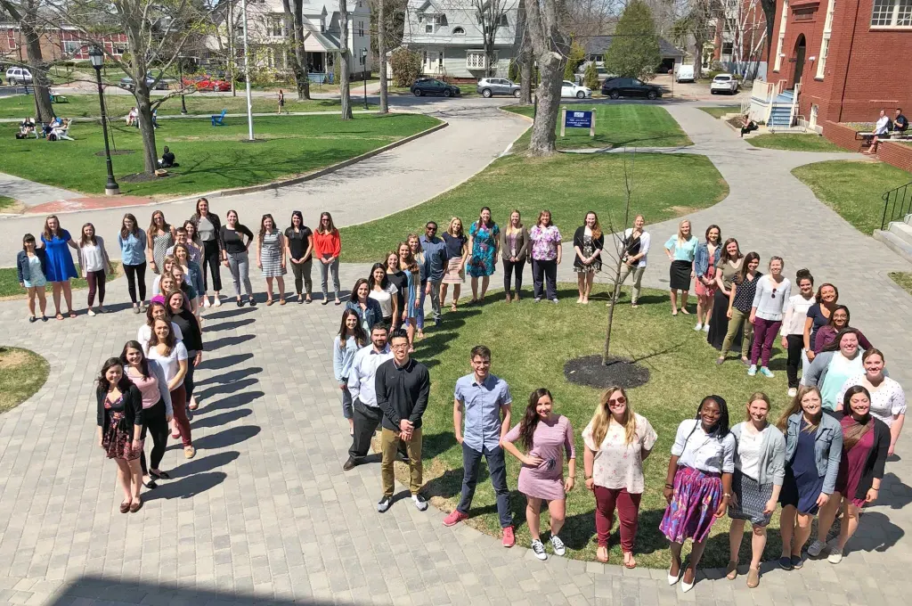 occupational therapy master's class of 2018 students stand in OT shape